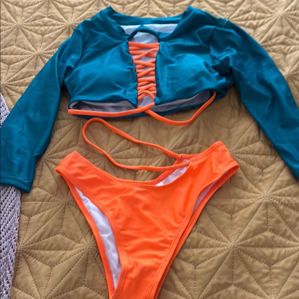 Women swim teal orange